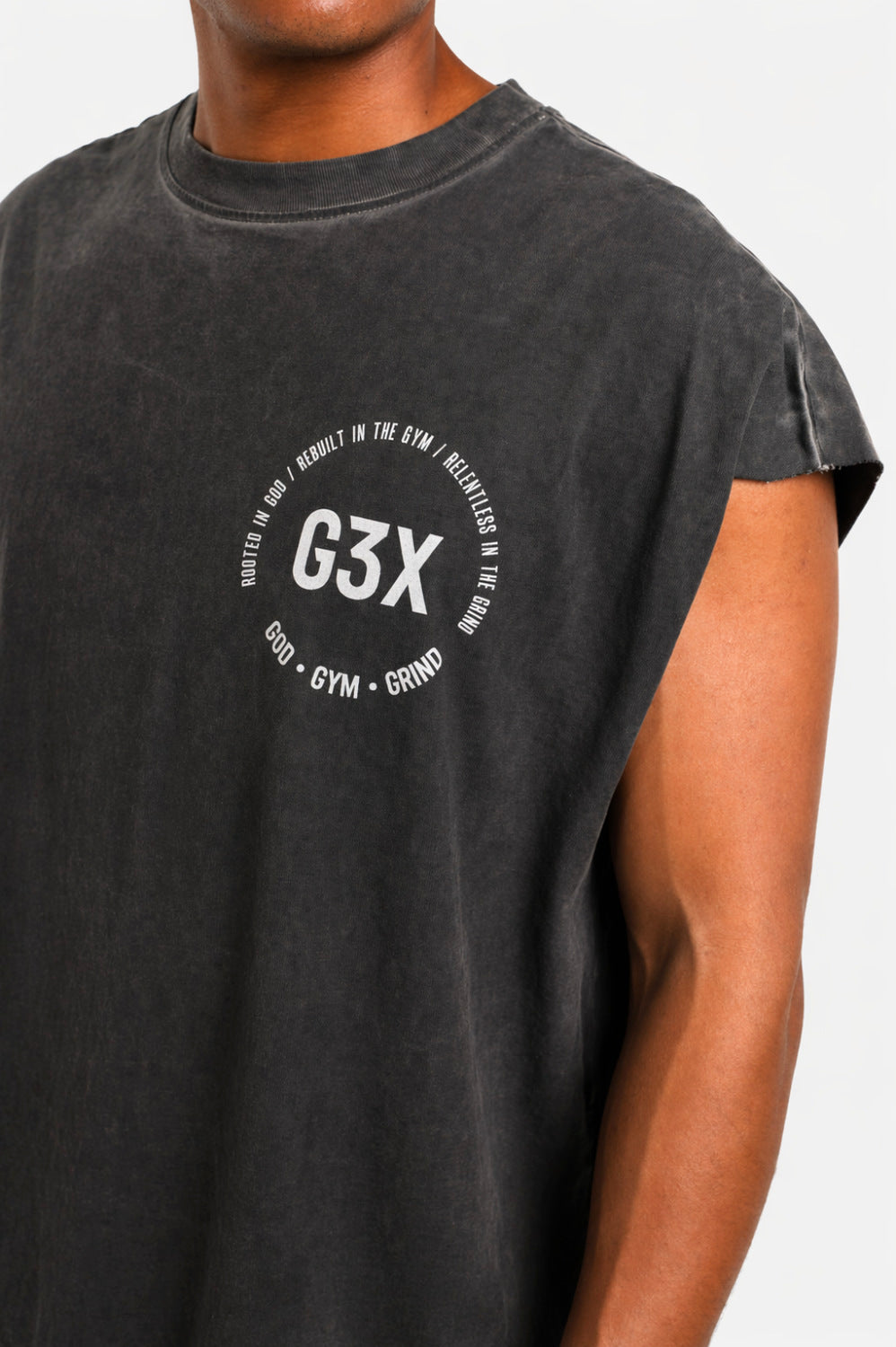 Person wearing a black t-shirt with 'G3X' logo on a background