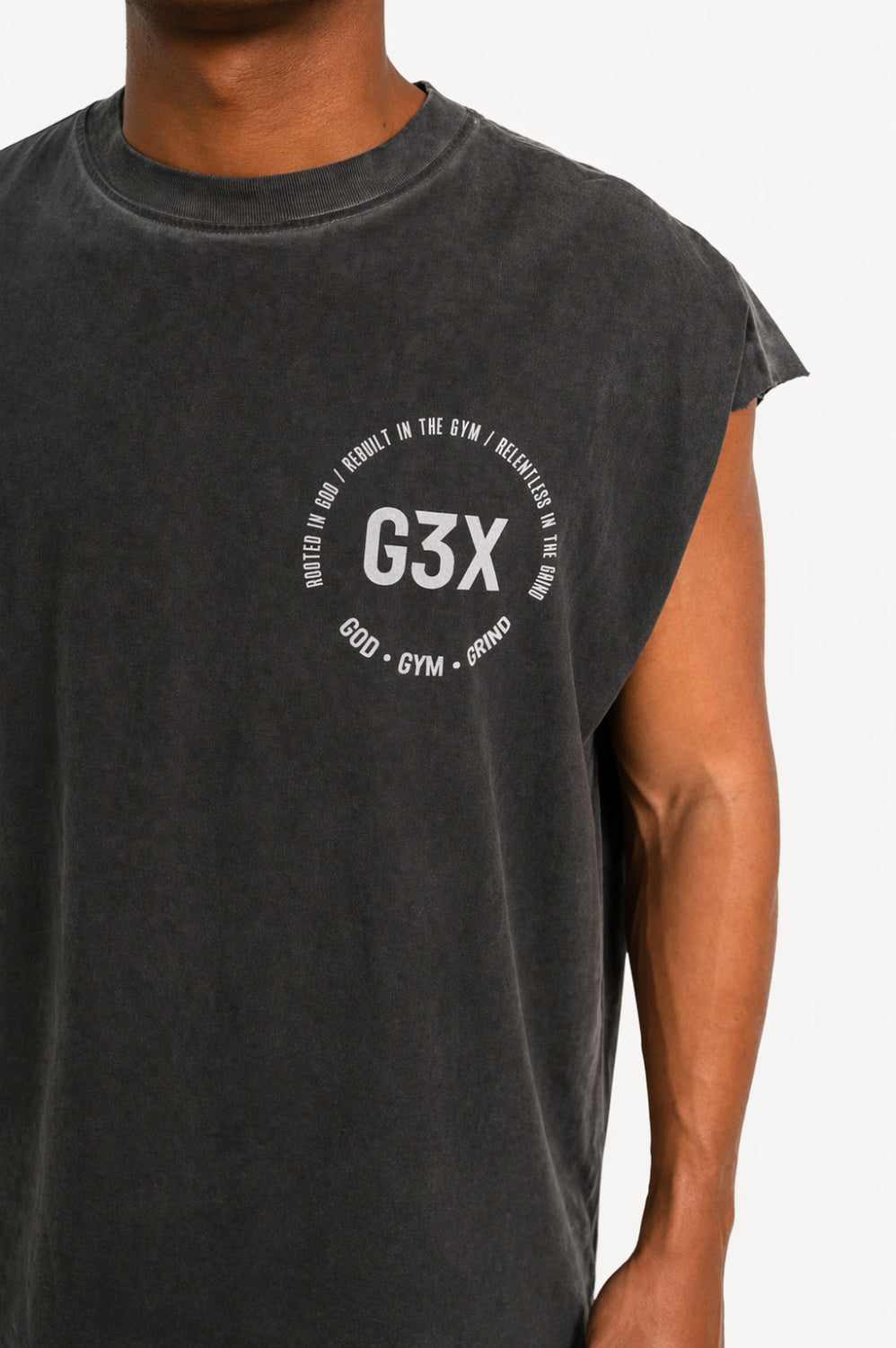 Person wearing a black t-shirt with 'G3X' logo on a background